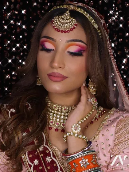 Our collection includes pieces for every style. This bride chose a vibrant look with our Polki and red bead rental set.