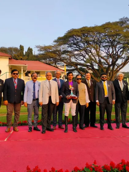 The presentation ceremony for The Narasimha Raja Trophy with the winning team of Pink Jasmine.