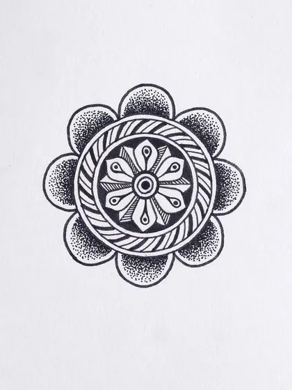 A small, circular motif with a woven texture in the center. This was part of my daily drawing practice for the Inktober challenge.