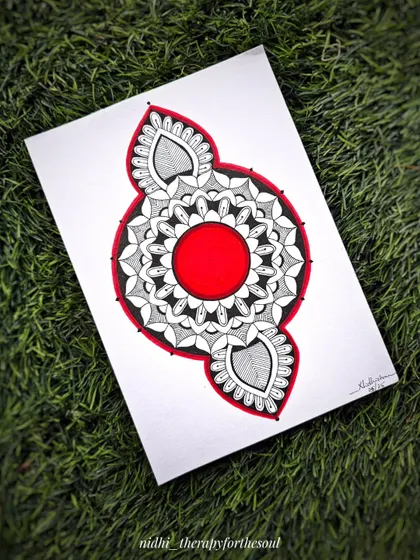 A simple yet striking mandala with a bold red center. Sometimes, I just let my hand flow without a plan, and the result is a spontaneous piece like this.