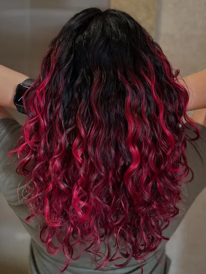 A still shot of the fiery pink color on these amazing curls. This proves that you can have both bold color and healthy, defined curls.