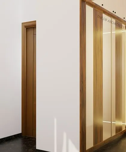 A 3D render of a parents' bedroom, designed for simplicity and harmony. This view shows the entrance to the walk-in wardrobe, which is designed to be both functional and discreet.