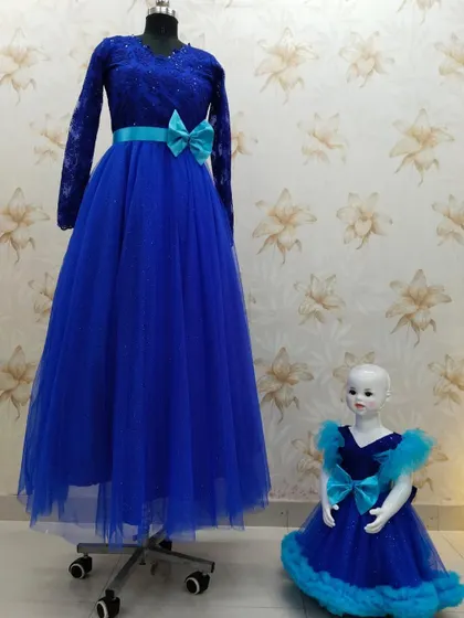 Here is another look at the royal blue twinning gowns. The matching bows on the waist tie the two outfits together perfectly.