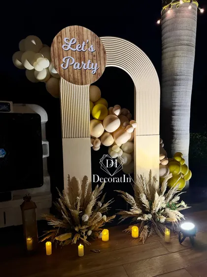 The "Let's Party" arch in its venue setting, demonstrating how our decor can create a distinct zone even in a larger space.
