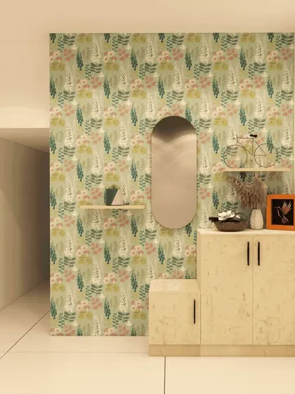 A whimsical foyer design with a floral wallpapered accent wall, a simple cabinet, and an arched mirror, perfect for a home with a soft, romantic aesthetic.
