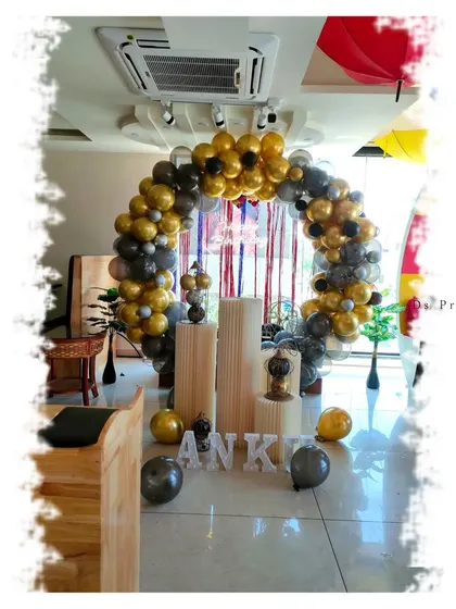 Another view of the gold and black themed birthday setup.