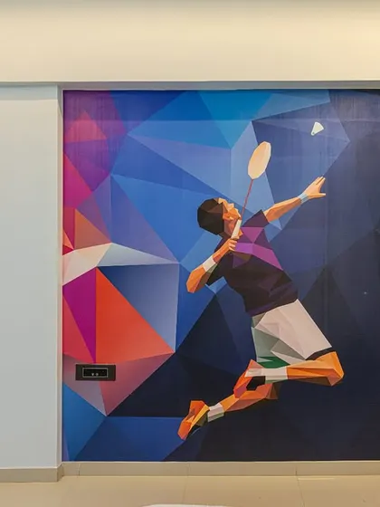 For a young badminton enthusiast, I used a custom geometric wallpaper to create a dynamic and energetic feature wall. It’s a great way to personalize a room based on a child's passion.