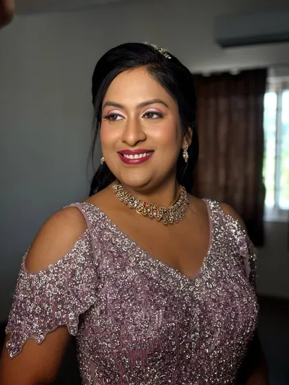 A gorgeous reception look. I used shimmering pink eyeshadow and a bold berry lip to create a look that is both glamorous and romantic.