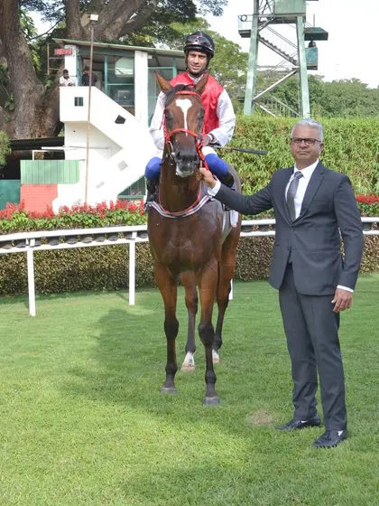 A champion in the making. Here is Positano, winner of The Governor's Cup, with trainer S.S. Attaollahi in the paddock. This is a behind the scenes look at the moments before the celebration.