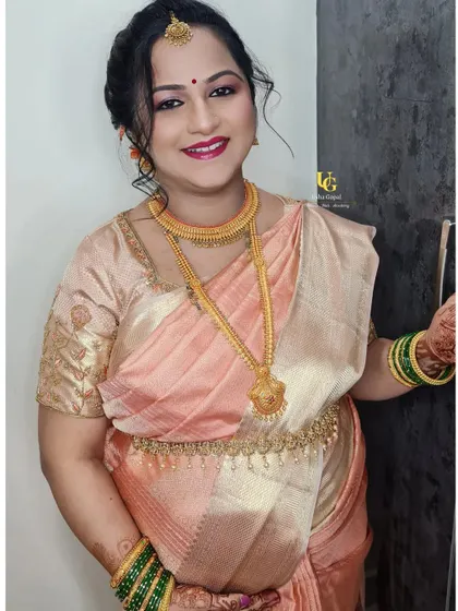 A stunning portrait of Shweta, showcasing her flawless baby shower makeup. The soft smokey eye and berry lip color enhance her joyful expression.