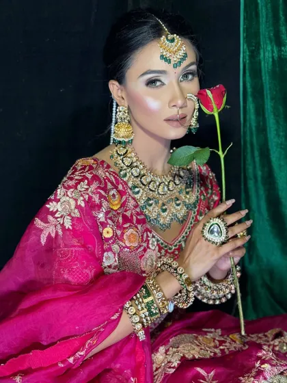 A classic bridal portrait. The makeup is balanced to perfection, with defined eyes, a neutral lip, and radiant skin that looks healthy and luminous, not heavy or cakey.