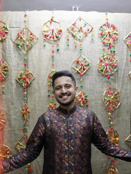 A happy picture in front of a traditional, festive backdrop. I love celebrating our culture through both music and style.