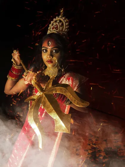 A powerful depiction of Goddess Durga, created for a Navratri-themed shoot. This look combines traditional elements with dramatic, artistic makeup.