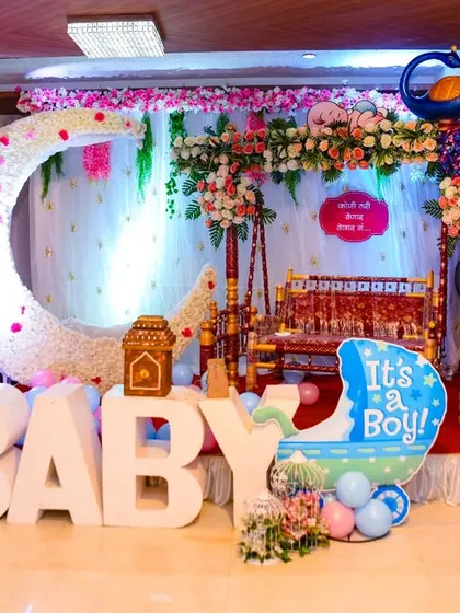 A grand baby shower decoration setup with "It's a Boy" and "It's a Girl" themes, ready for the celebration.