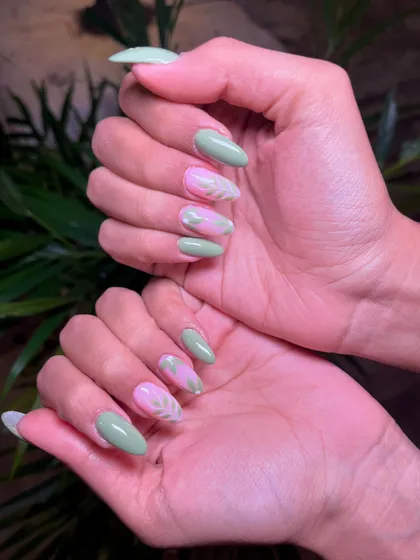 A full view of the pastel green and pink leaf-themed manicure, perfect for a fresh, springtime look.