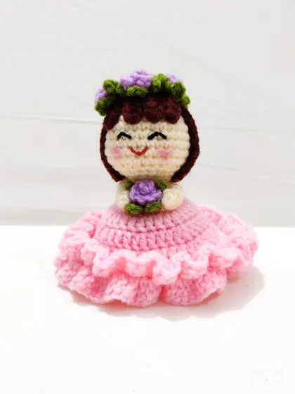 The sweet smiling face of the reversible doll.