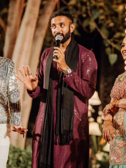 The emcee interacting with the couple during their Sundowner Sangeet. I work with the best vendors to ensure a seamless and entertaining event.