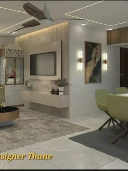 This angle shows the TV unit set against a marble-finish wall panel. The open layout connects the living and dining areas, making it ideal for modern family living in Mumbai.