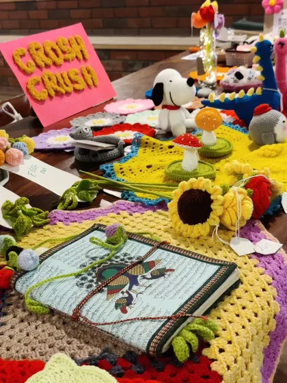 A close-up of my stall setup, featuring a variety of my crochet creations.