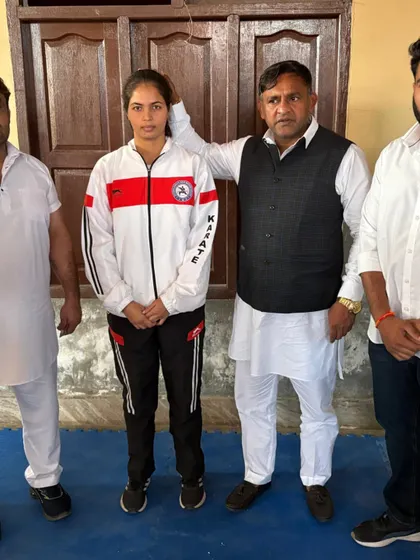 A senior female student being recognized by officials. Her journey is an inspiration to others in the girls' batch.