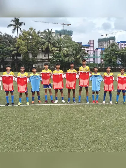 Another shot of our alumni holding up their new club jerseys, showcasing the pathway we provide for young talent.