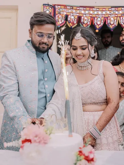 A sweet moment for the newly engaged couple during their cake cutting. Her soft, romantic makeup is perfect for the occasion.
