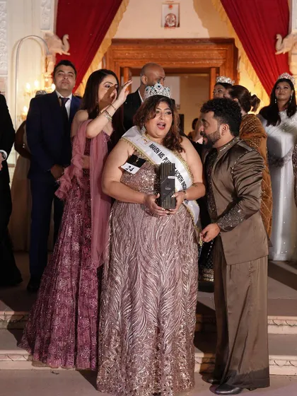 A candid moment during the crowning ceremony. The joy and excitement are palpable.