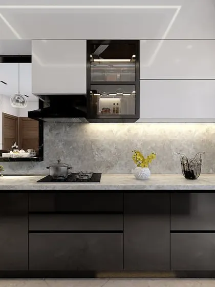 This angle highlights the glossy finish of the kitchen cabinets and the under-cabinet lighting that illuminates the workspace.