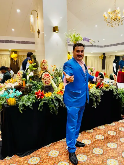 Posing at a beautifully decorated event hall. I always dress for the occasion, adding a touch of professional class to your party or celebration.