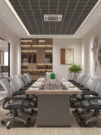 Another view of the conference room, showing the built-in wooden shelving for storage and display. The glass partition maintains an open feel while providing necessary privacy.