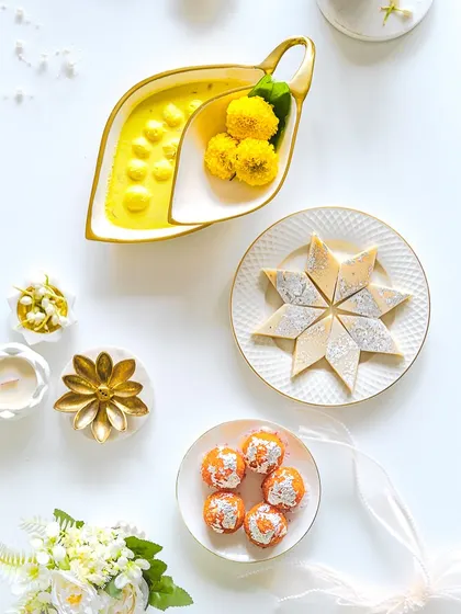A bright, high-key flatlay of Diwali sweets, offering a clean and modern take on festive food photography.