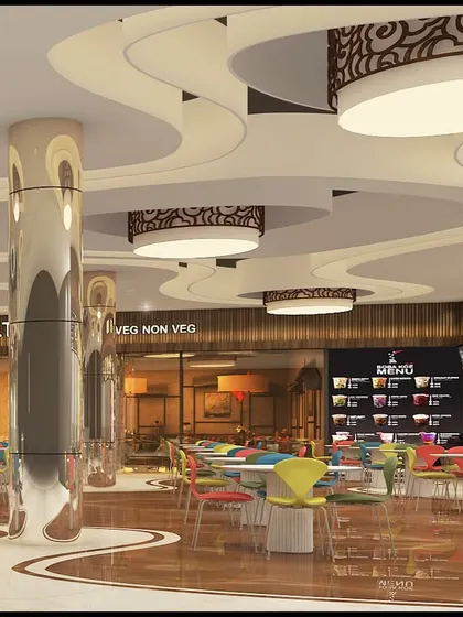 Another perspective of the food court at LP Walk Mall, showing the reflective pillars and custom light fixtures. The layout is designed to be open and easy to navigate while accommodating multiple food vendors.