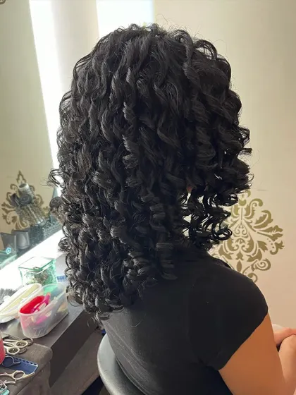 Another angle of the beautiful curl definition achieved with this cut.