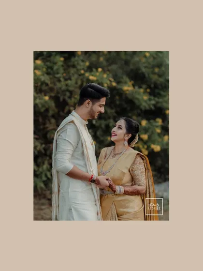 A classic portrait of the couple sharing a look of love. The simple, natural background keeps the focus entirely on their connection.