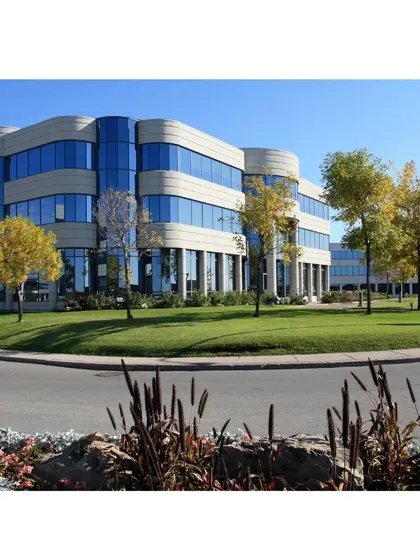 A well-maintained landscape is a direct reflection of your business. For this corporate campus, we created a clean, professional look with manicured lawns and strategically placed trees that complement the modern architecture.