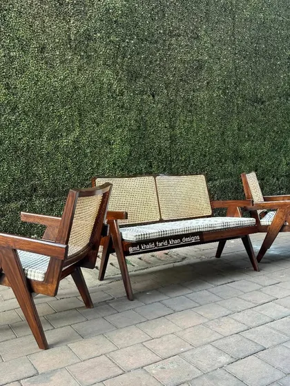 This is my take on the iconic Pierre Jeanneret "Kangaroo" set, including a two-seater sofa and matching lounge chairs. Built from solid teak with hand-woven cane and custom upholstery, this set is perfect for hotel lobbies or high-end lounge areas.