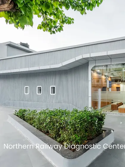 The exterior of the Northern Railway Diagnostic Centre showcases how adaptive reuse can modernize an existing structure. The clean lines and large glass panels create a contemporary look that signals a high-tech, patient-focused facility.