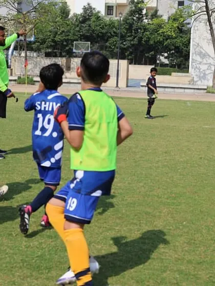 Players from two teams get into position during a league match.