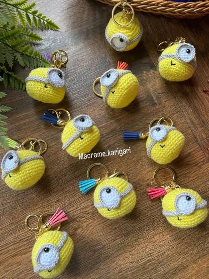 A collection of our Minion crochet keychains, ready to be dispatched. We add colorful tassels to some for extra flair. They make great party favors or small gifts for fans.