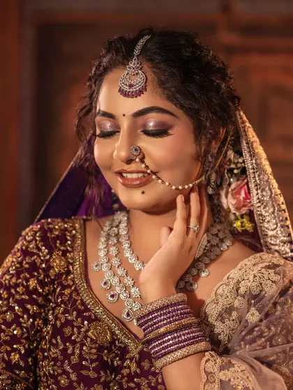 Another beautiful close-up capturing the essence of a bride's happiness. The diamond jewellery pairs perfectly with the detailed embroidery of the lehenga, creating a sparkling and unforgettable look.
