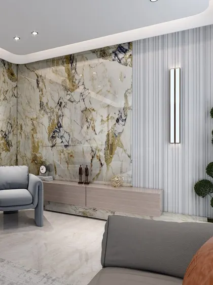 A detail shot of a living room corner, featuring a stunning marble TV wall with gold and blue veining. This element serves as a luxurious focal point, adding drama and visual interest to the space.