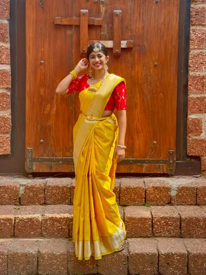 My daughter feeling her best in a full traditional look, with a saree, blouse, and jewellery all from our manSi collection.