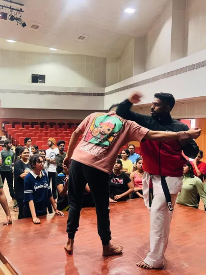 A close-up of a blocking technique being taught during the NIFT self-defense seminar.