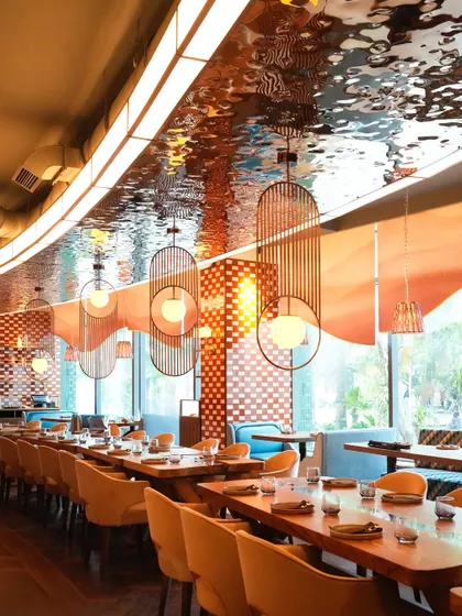 The design of our Mumbai space features a stunning, reflective ceiling that adds a touch of glamour and light, making the dining experience feel even more special.