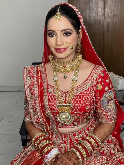 Mansi's bridal look was a beautiful blend of traditional and modern. We paired a classic red lehenga with a soft smokey eye and a glowing base.