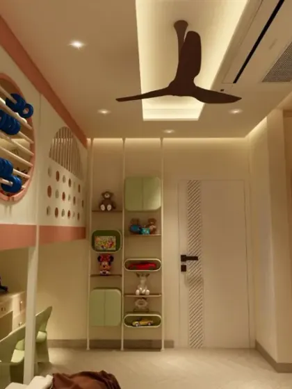 This view shows the smart layout of the room, with the play area, study desk, and bunk beds all seamlessly integrated.