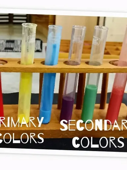 Our color mixing station, with test tubes of primary colors ready for experimentation. This visual setup invites children to predict what will happen when they mix the colors.