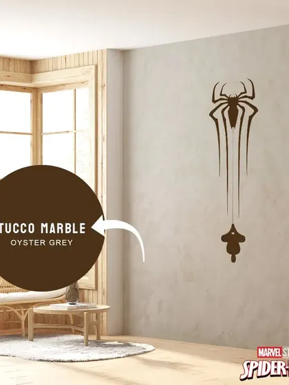 A subtle and sophisticated take on a Spider-Man theme, using the spider logo as a single piece of art on a textured grey wall.