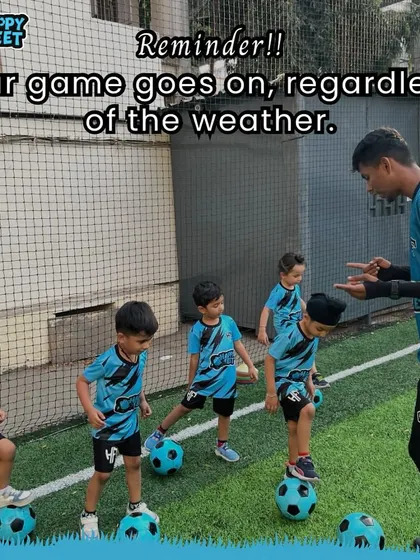 A little rain can't stop us! Our coach reminds the team that the game goes on. Here, the kids are practicing their footwork, learning to balance on the ball, which is a great activity for building core strength and stability.