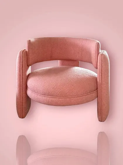 A front view of the "Pebble" chair, emphasizing its inviting, curved back and comfortable, rounded seat.